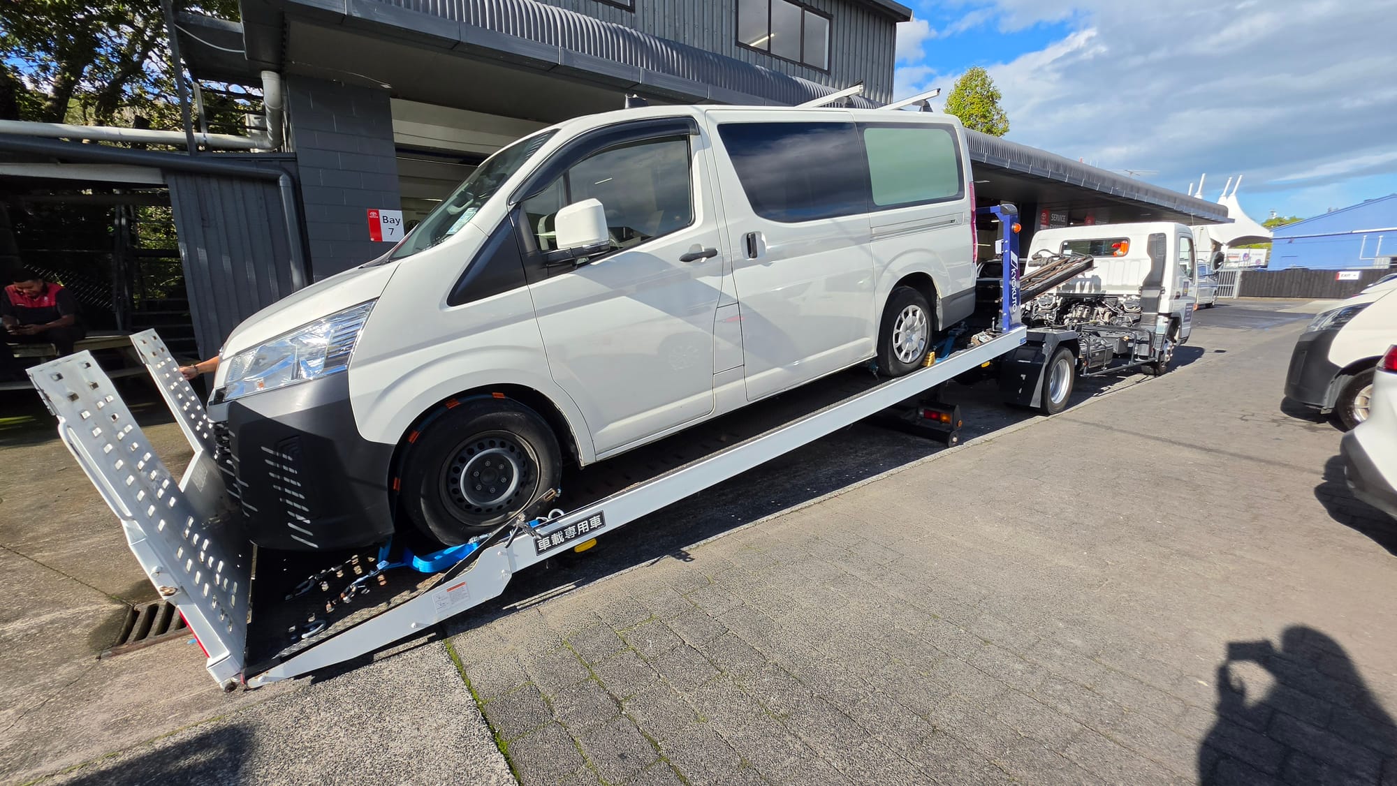 Drive1 Towing flatbed tilted to load a low-clearance Toyota van in Auckland.